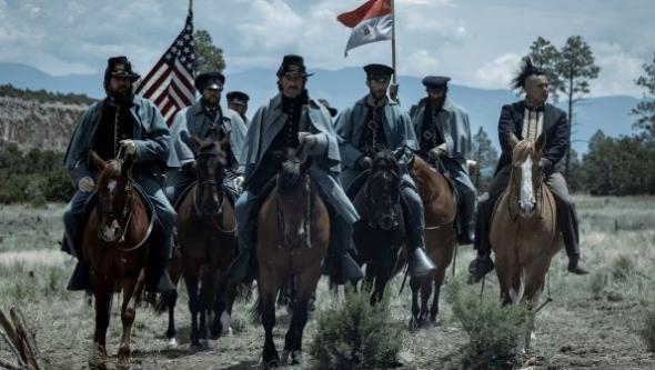 american-soldiers-on-horseback-with-flags-in-the-netflix-western-series-american-primeval.jpg